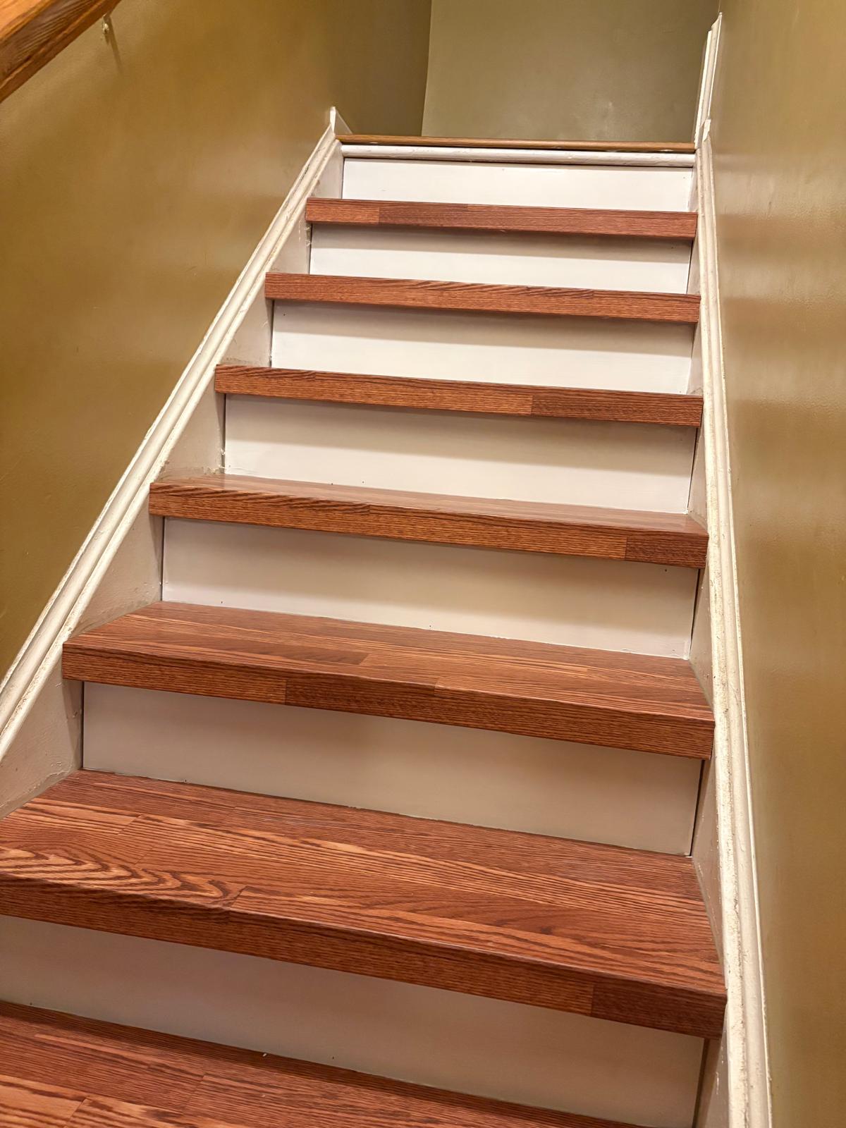 Staircase with new wood treads and white painted risers