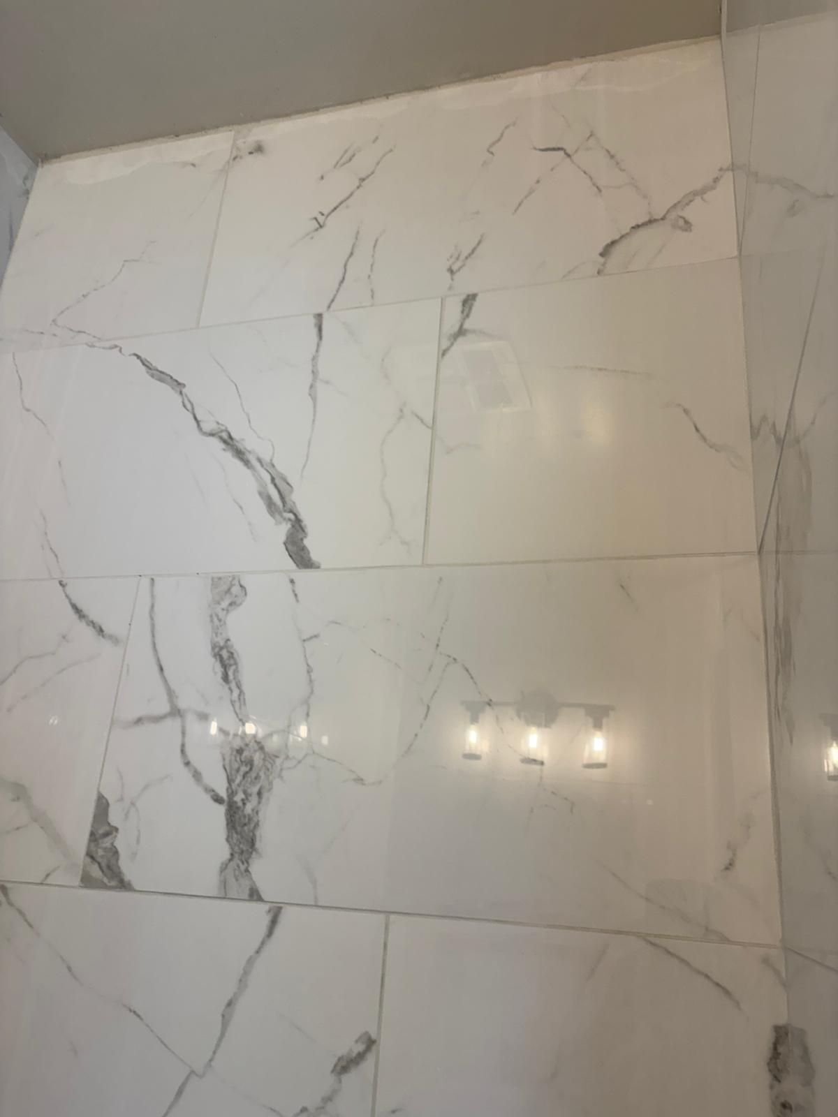 Large-format porcelain tile installed in bathroom