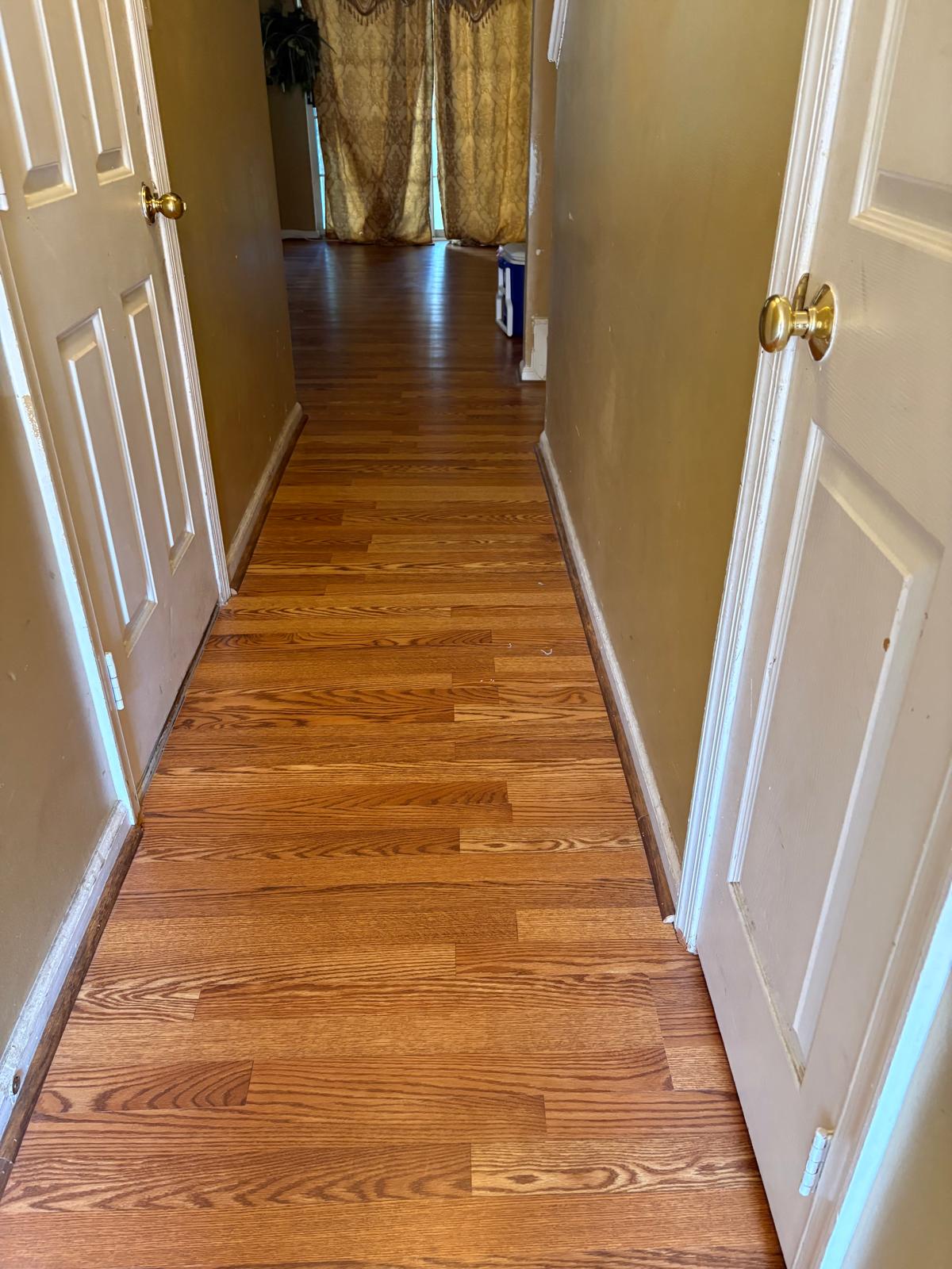 Hardwood flooring planks being installed